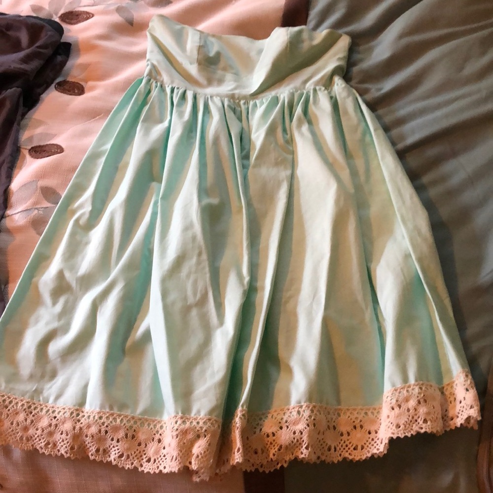 Mint and lace strapless dress.